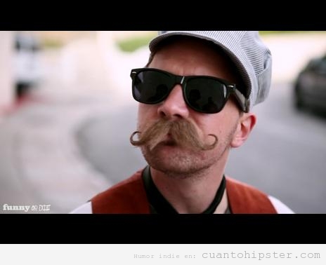 Foto graciosa de un hombre con look hipster y un gran bigote