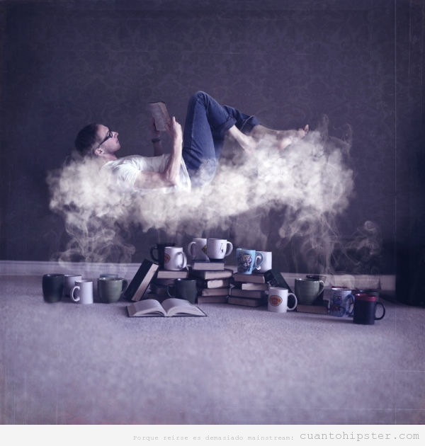 Foto bonita de un chico leyendo sobre una nube de vapor de tazas de té y café