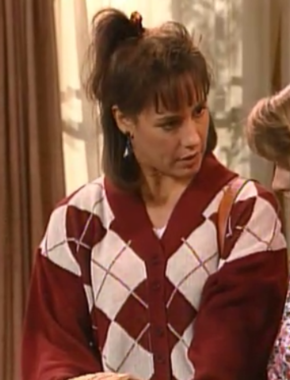 Jackie de la serie Roseanne con jersey hipster
