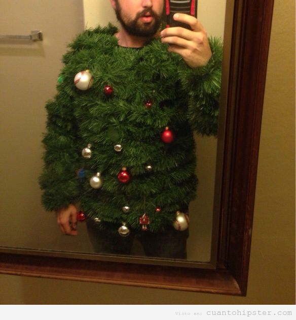 Chico hipster con un jersey de árbol de Navidad